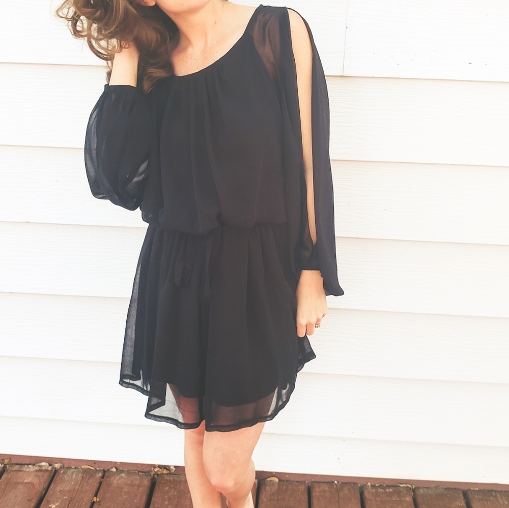 Black flowy dress with arm sleeve slit